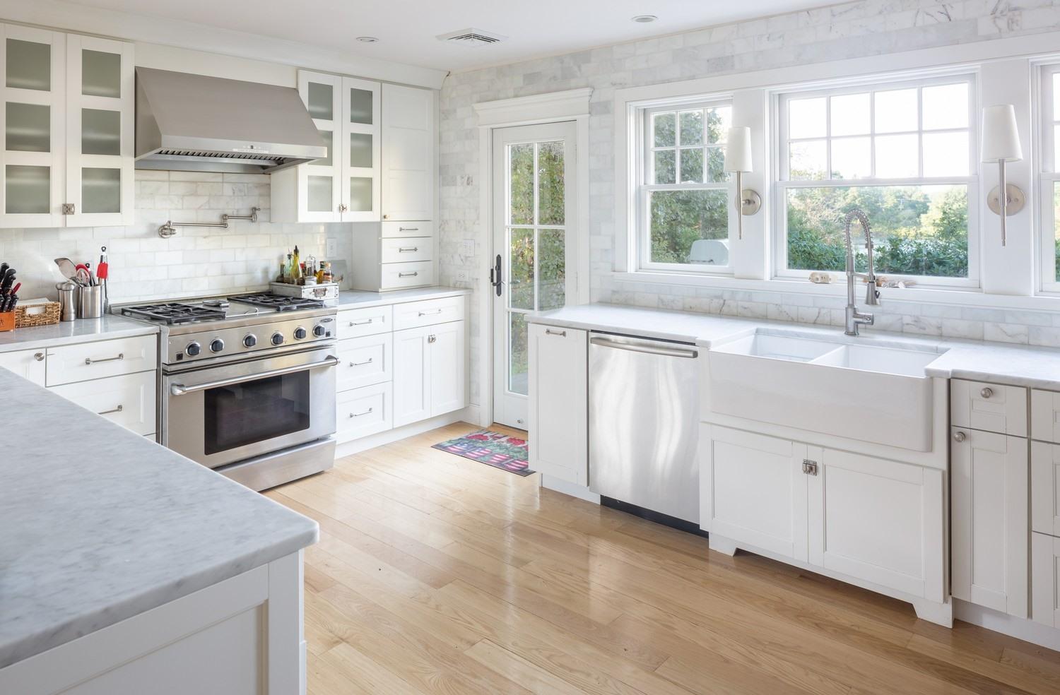 721 Samoset Road Eastham, MA 02642 - Photo 22 of 32 a kitchen with granite countertop a sink stainless steel appliances and window