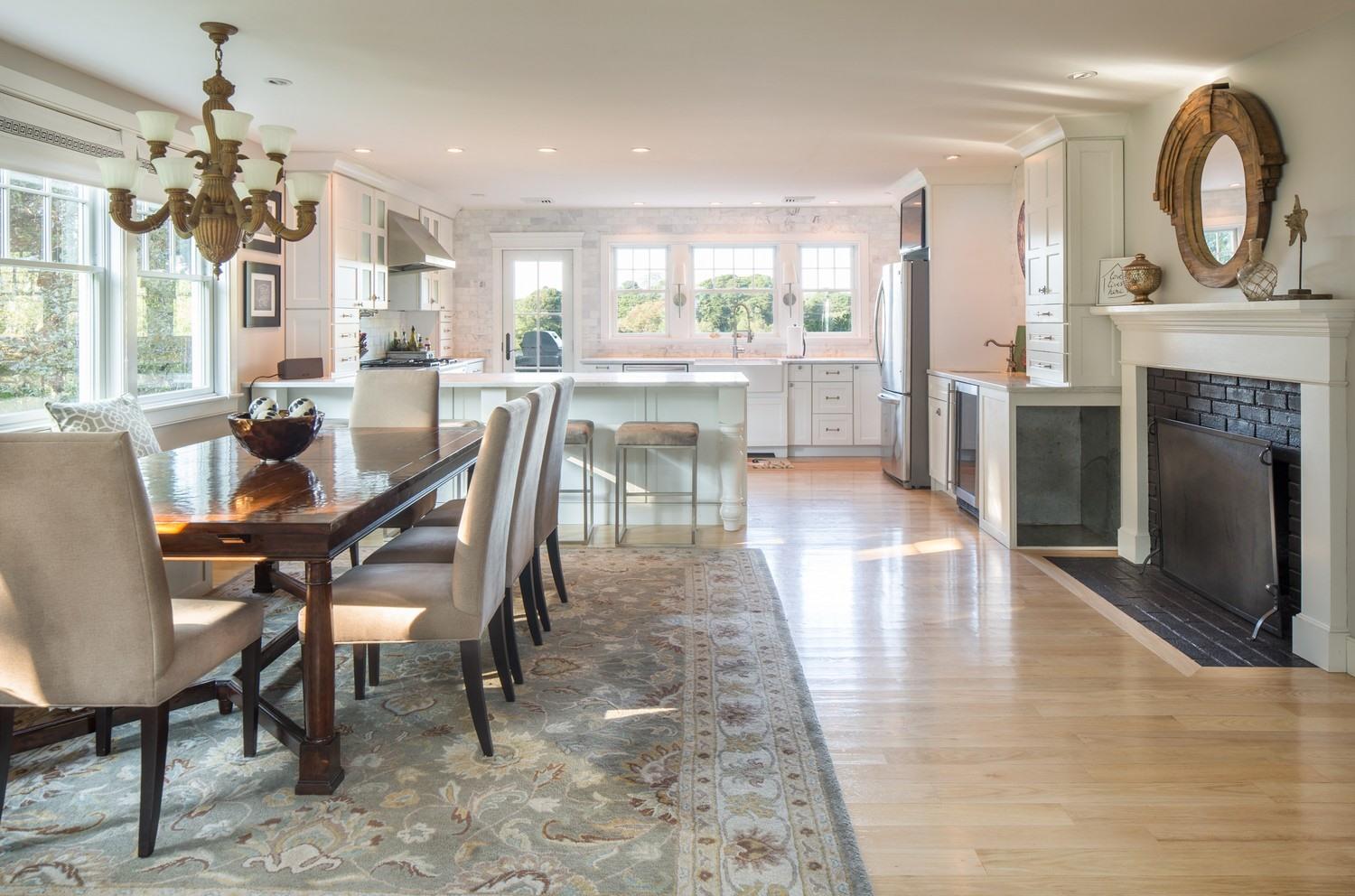 721 Samoset Road Eastham, MA 02642 - Photo 24 of 32 a view of a dining room with furniture a chandelier and wooden floor