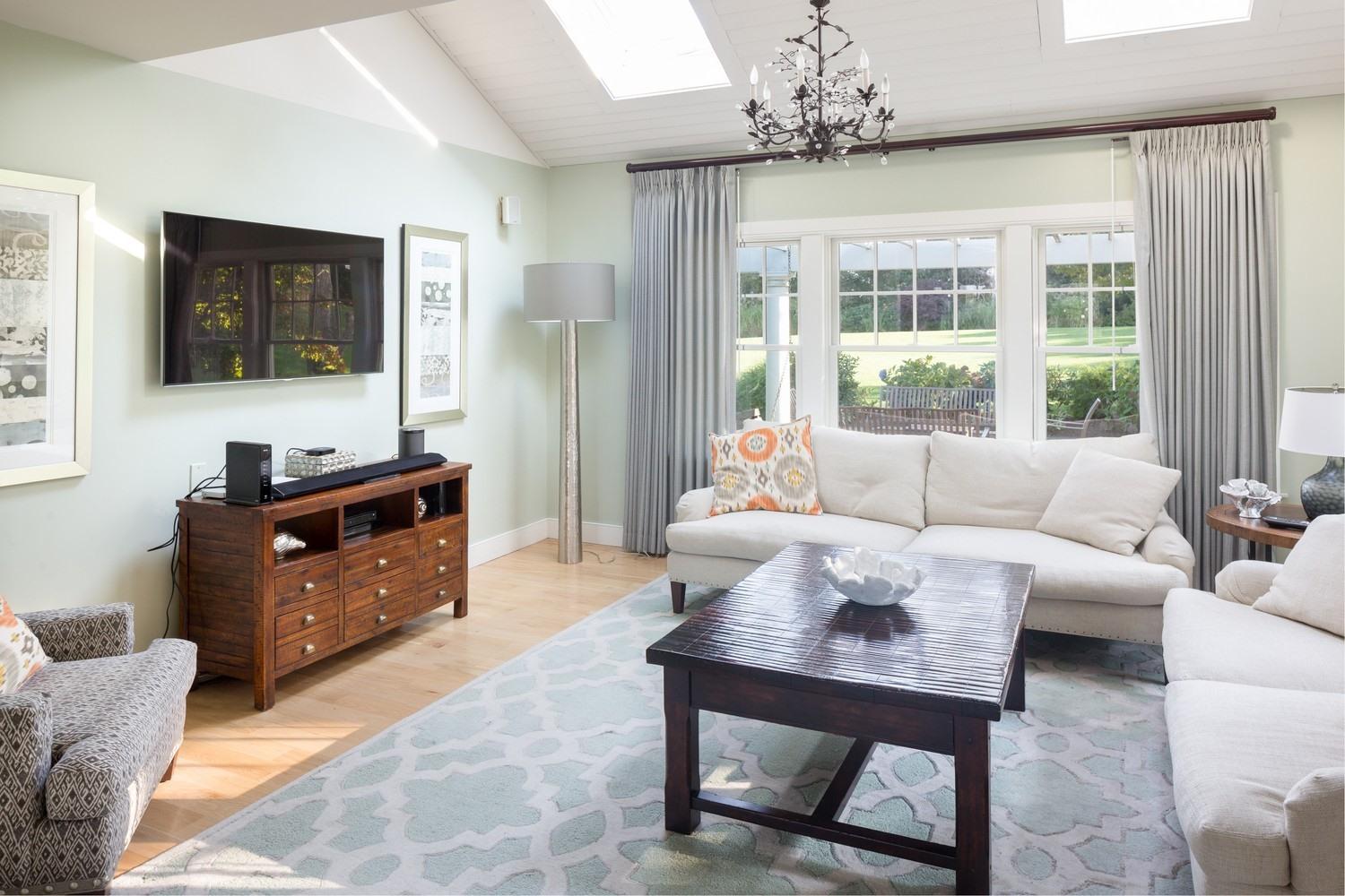721 Samoset Road Eastham, MA 02642 - Photo 25 of 32 a living room with furniture and a flat screen tv