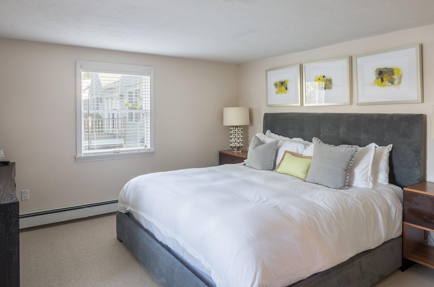 721 Samoset Road Eastham, MA 02642 - Photo 26 of 32 a large bed sitting in a bedroom next to a window