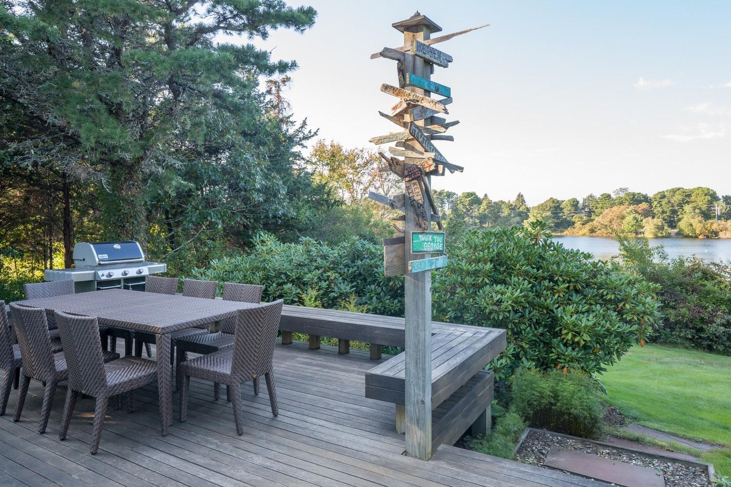 721 Samoset Road Eastham, MA 02642 - Photo 30 of 32 a view of a dinning table and chairs in the garden