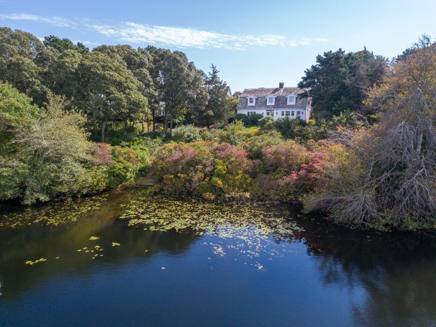 721 Samoset Road Eastham, MA 02642 - Photo 3 of 32 a view of a city street from a lake