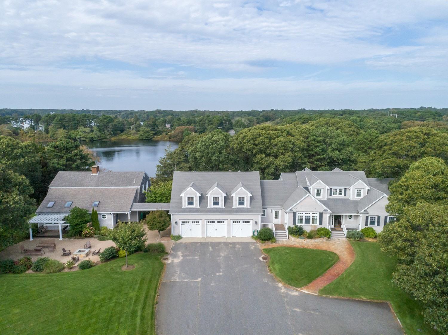 721 Samoset Road Eastham, MA 02642 - Photo 5 of 32 a view of a street with houses in the back