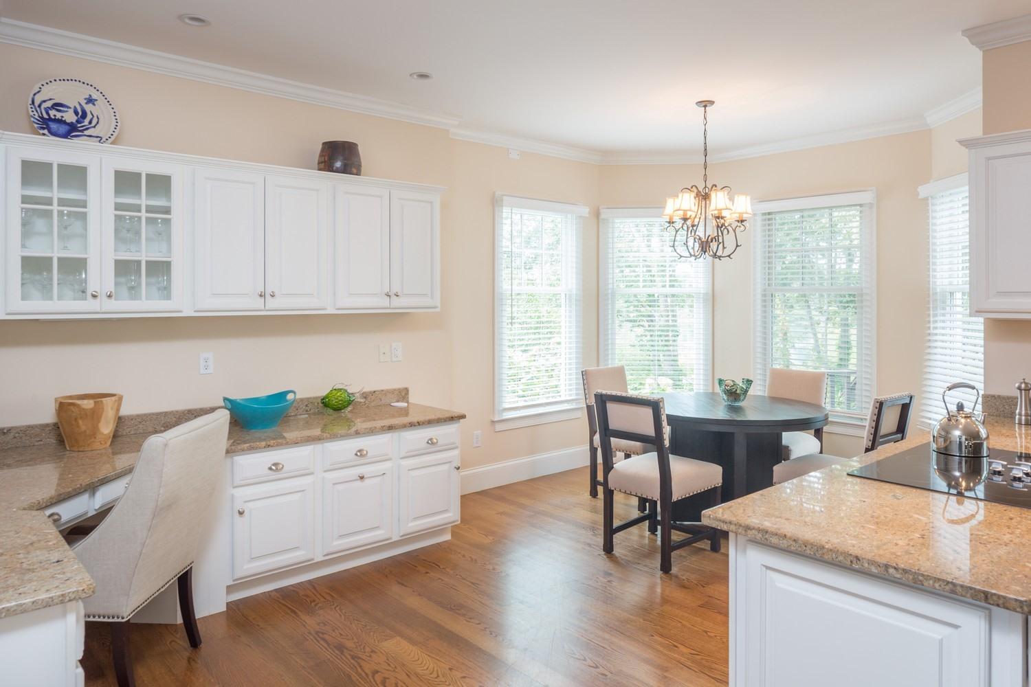 721 Samoset Road Eastham, MA 02642 - Photo 9 of 32 a view of a dining room with furniture window and wooden floor