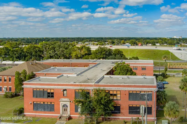 an aerial view of a house with a garden