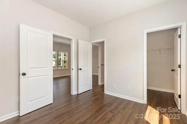 a view of hallway with wooden floor