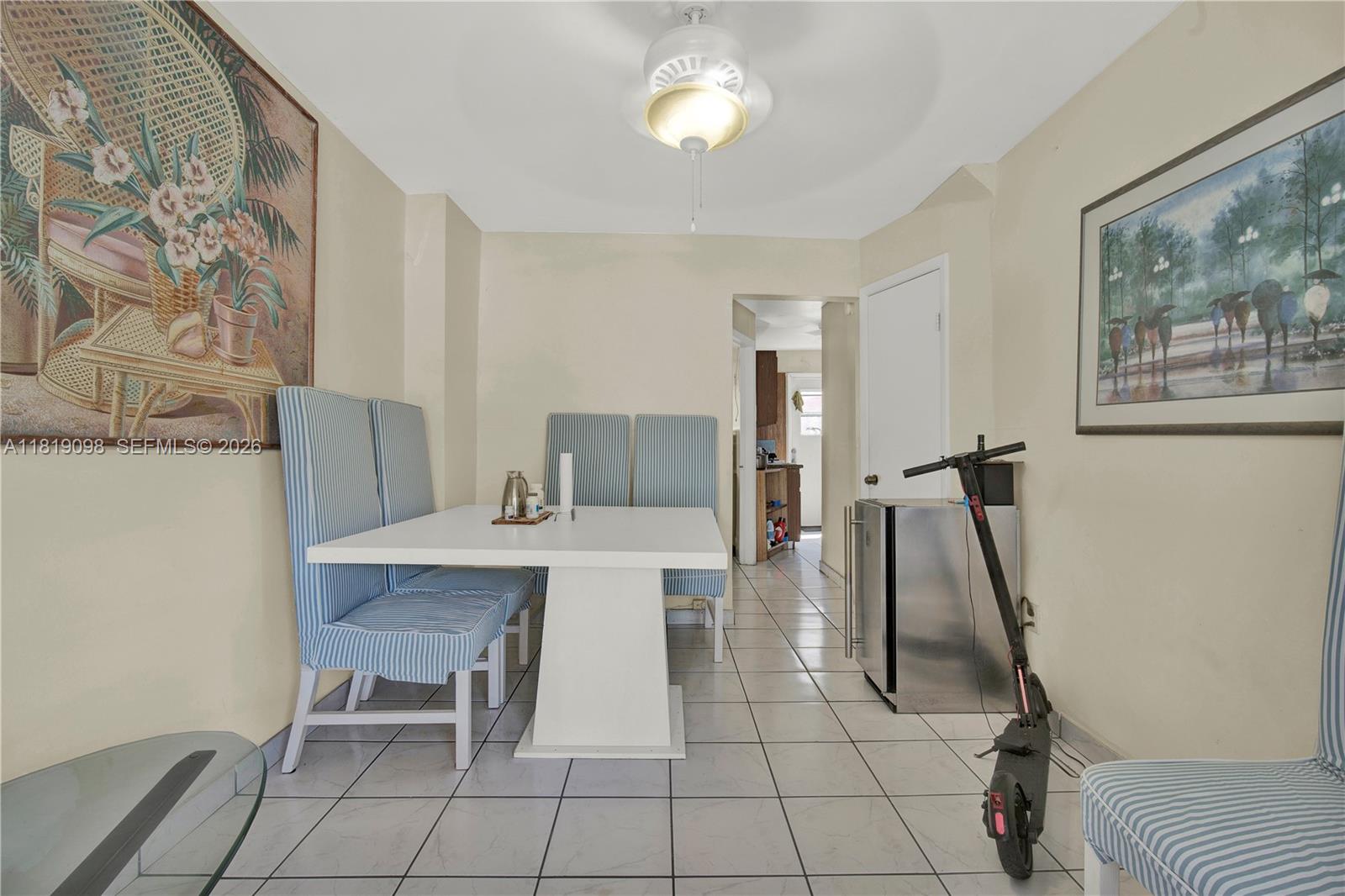 829 Southwest 19th Avenue Miami, FL 33135 - Photo 27 of 54 a view of a workspace with furniture and a table