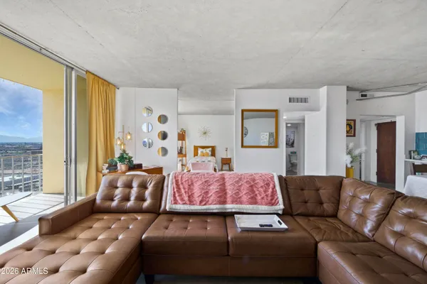 a living room with furniture and a large window