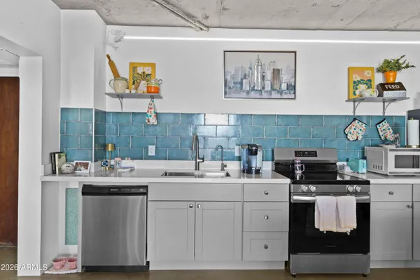 a kitchen with a sink and cabinets