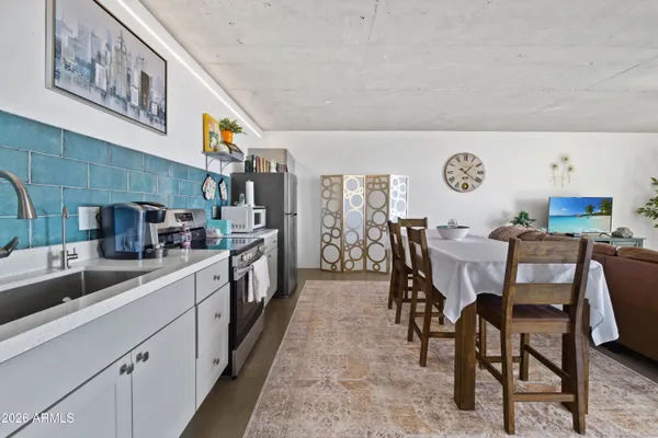 a kitchen with stainless steel appliances granite countertop a sink and cabinets