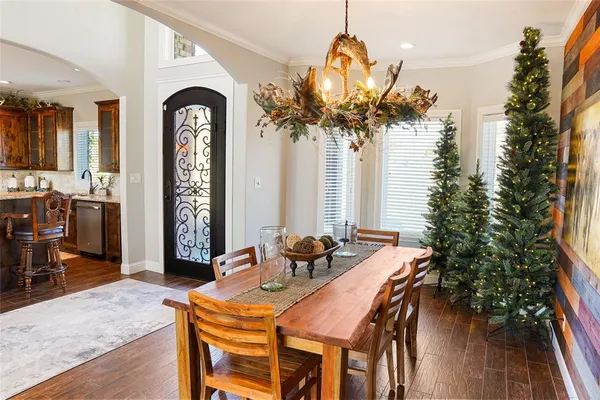 a dining room with furniture and window