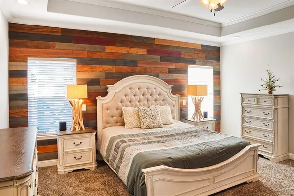 a bed room with a bed and a large window