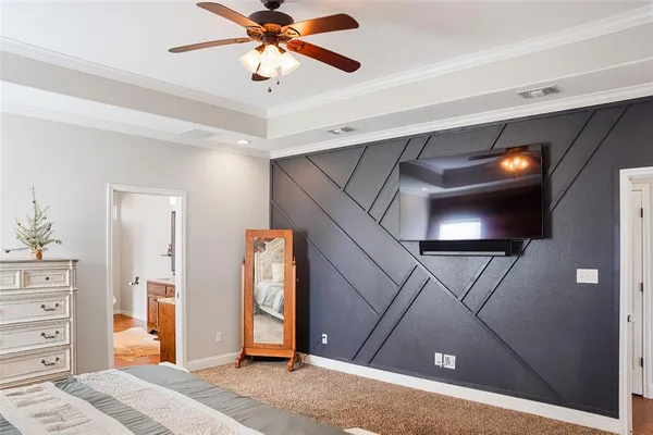 a spacious bathroom with a tub sink and mirror