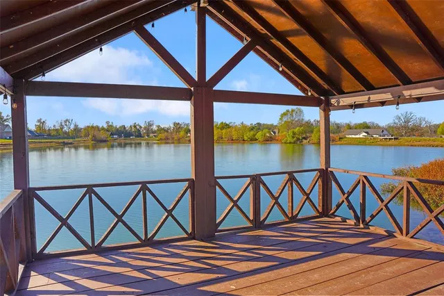 a view of an outdoor space with wooden floor and pool table
