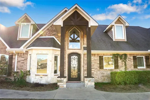 a front view of a house with outdoor space