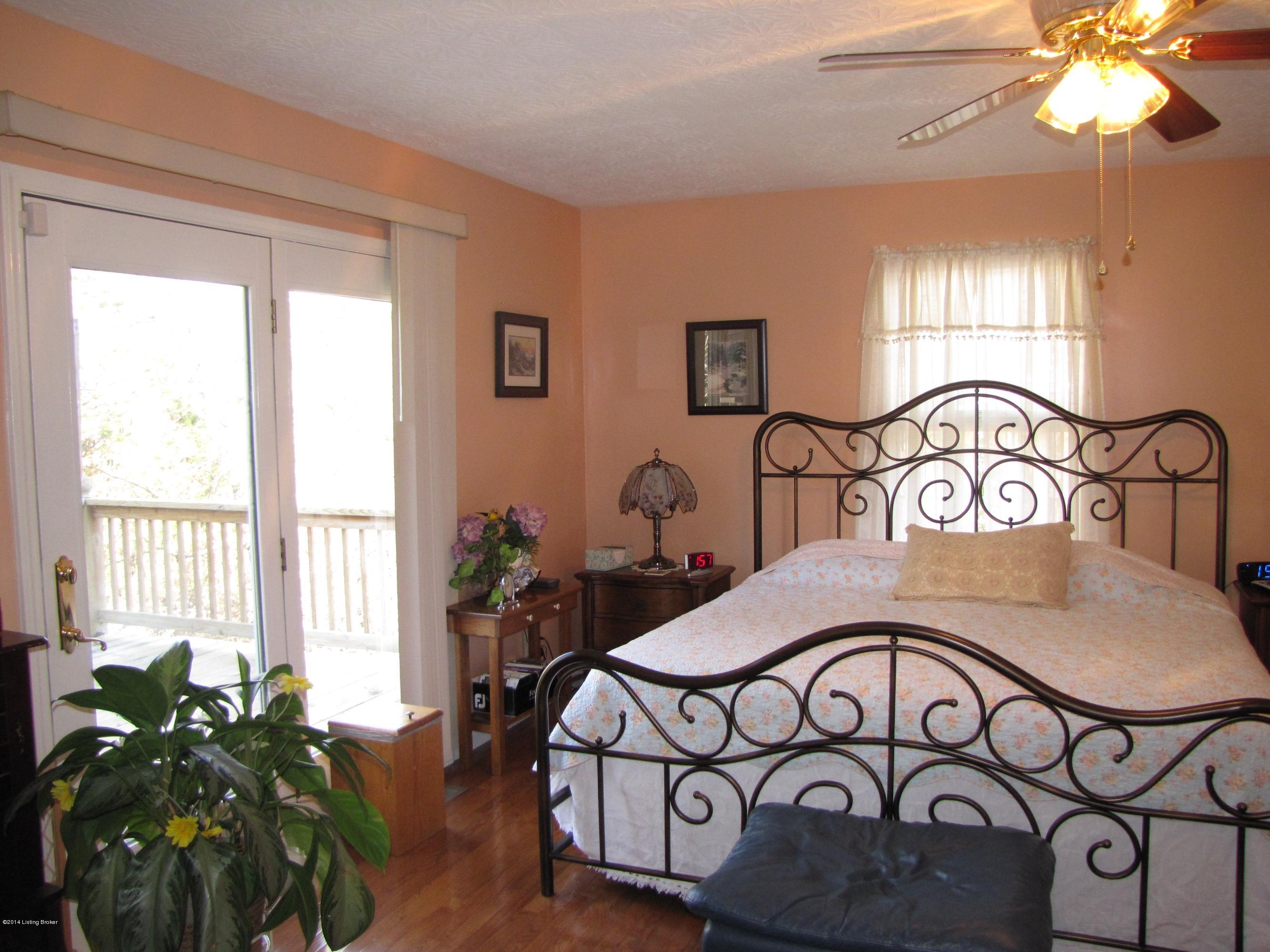 218 Fox Run Road Pendleton, KY 40055 - Photo 16 of 54 The spacious master bedroom is complete with warm hardwood flooring and a private entry to the back deck
