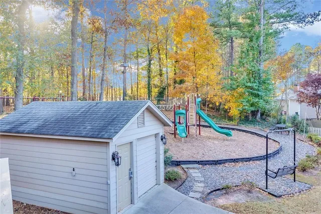 a view of outdoor kitchen and tree