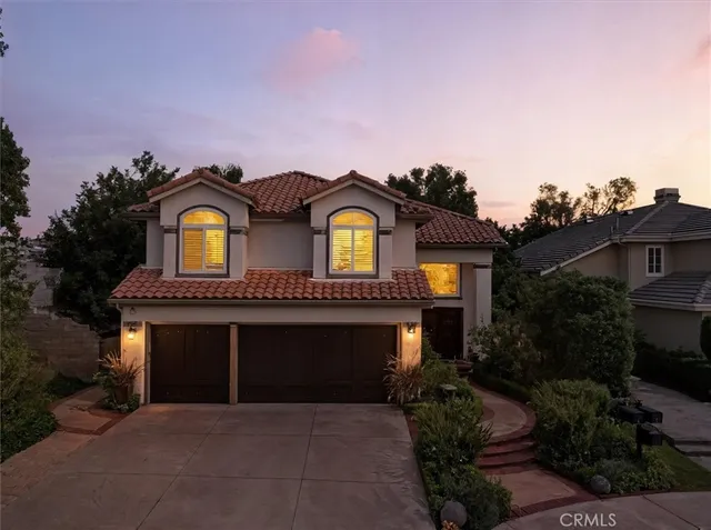 a kitchen with stainless steel appliances granite countertop a sink refrigerator and microwave