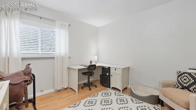 a bedroom with a bed and a table