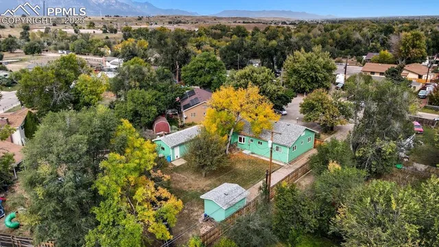 an aerial view of residential houses with outdoor space