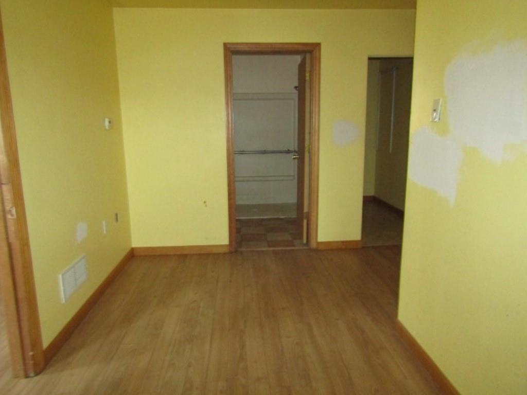 255 Duncan Avenue Washington, PA 15301 - Photo 26 of 39 an empty room with wooden floor and door