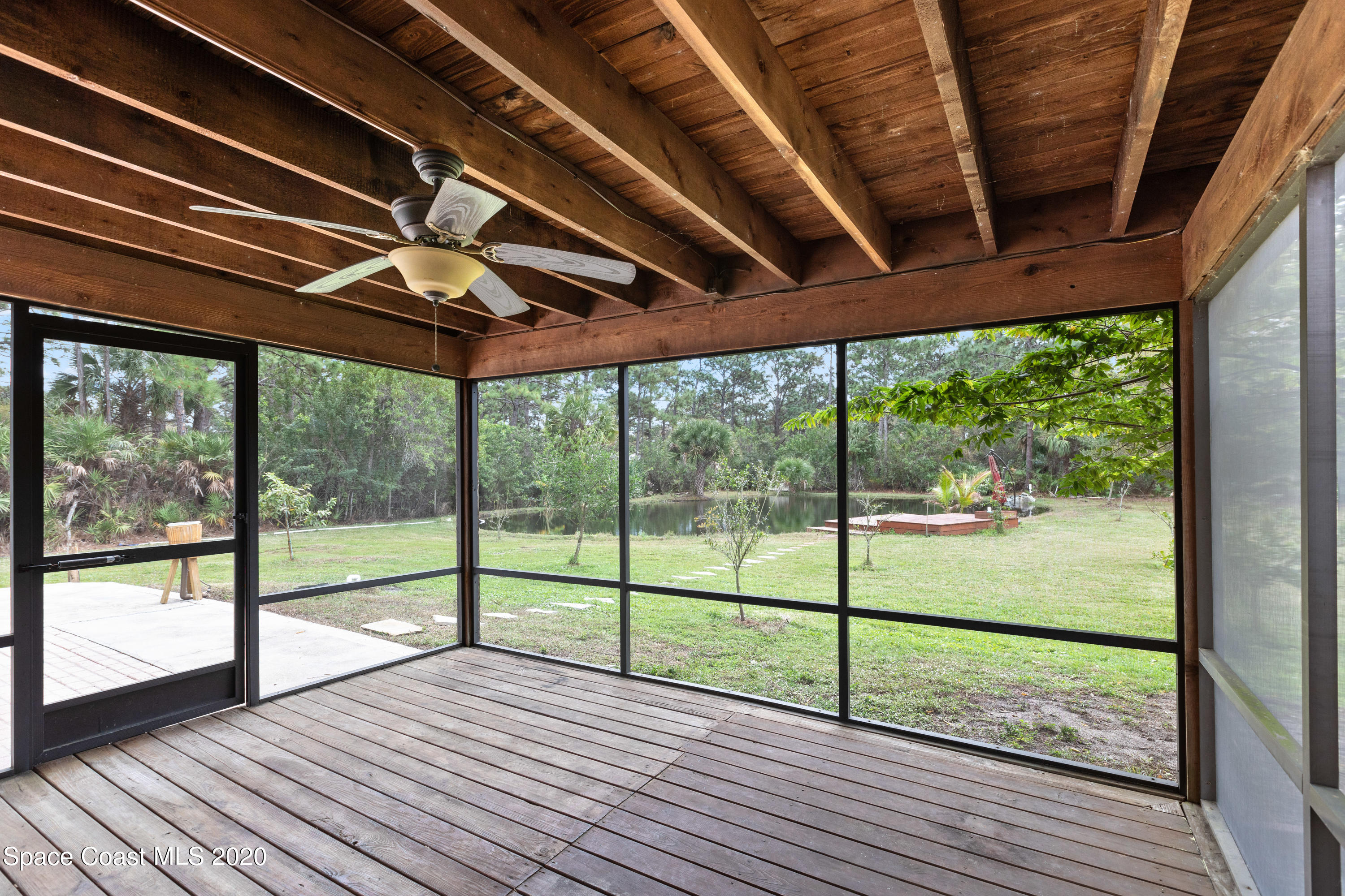 1531 Hall Road Malabar, FL 32950 - Photo 22 of 63 a view of a room with wooden floor and balcony