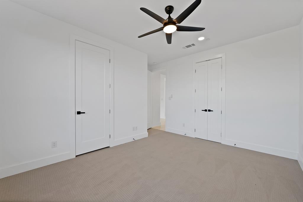 443 Whispering Way Red Oak, TX 75154 - Photo 28 of 36 an empty room with ceiling fan and window