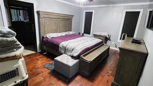 a bedroom with a bed and a mirror