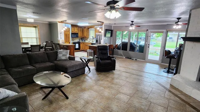 a living room with furniture and a large mirror