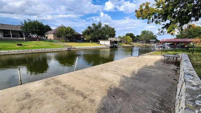 a view of a lake with a yard