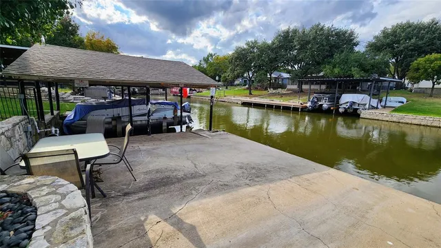 a view of house with outdoor space and sitting area