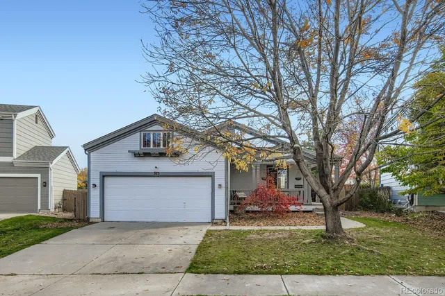 a front view of a house with yard
