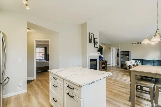 a kitchen with stove and cabinets