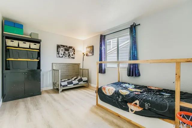 a bedroom with bed and window