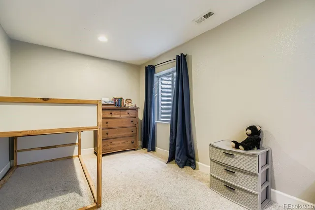 a view of walk in closet with clothes