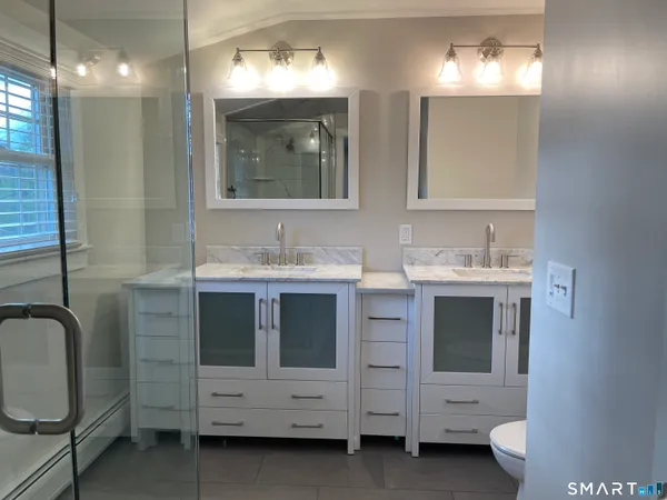 a bathroom with a shower and a window