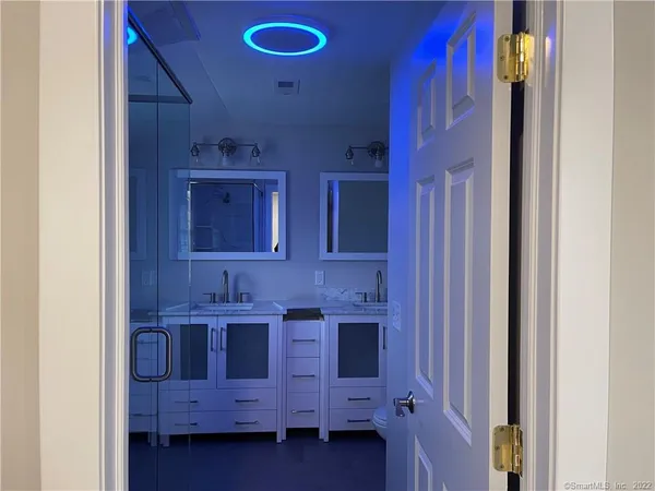 a bathroom that has a glass shower door