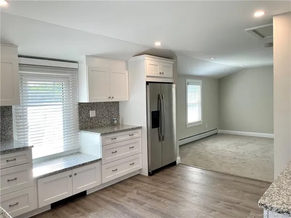 a kitchen with a stove and a microwave