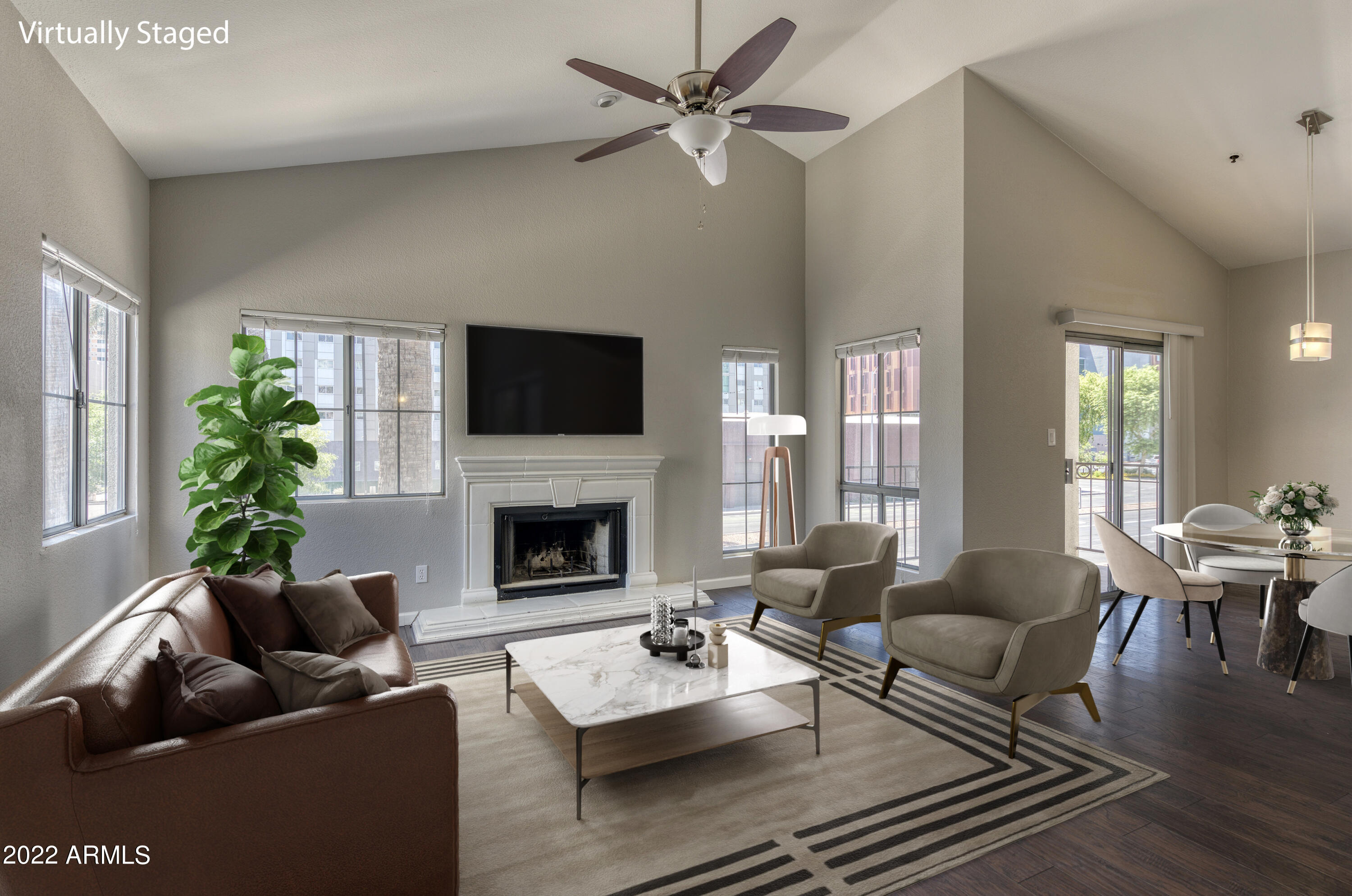 100 East Fillmore Street, Unit 201 Phoenix, AZ 85004 - Photo 1 of 23 a living room with furniture a fireplace and a potted plant