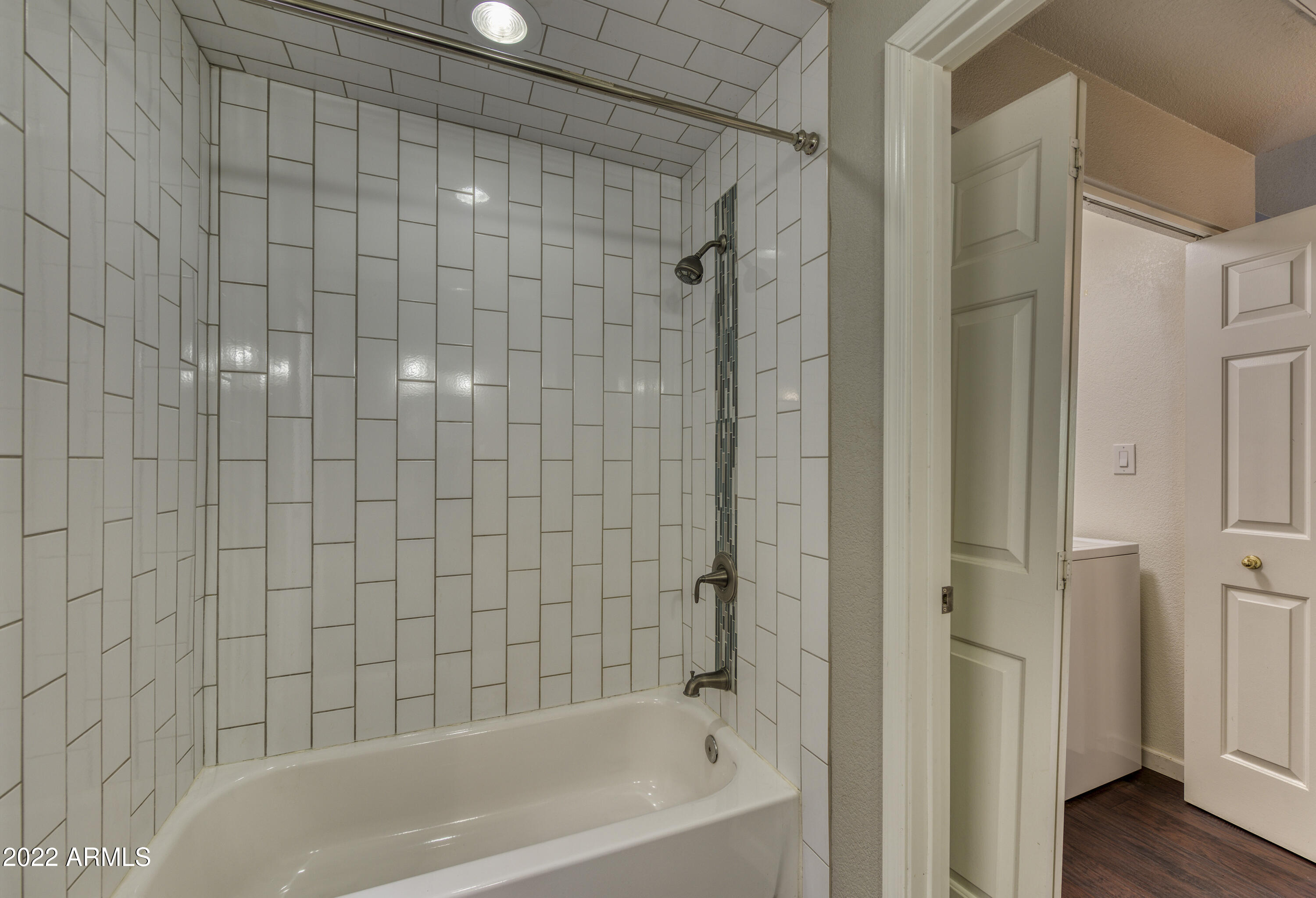 100 East Fillmore Street, Unit 201 Phoenix, AZ 85004 - Photo 16 of 23 a bathroom with a bathtub