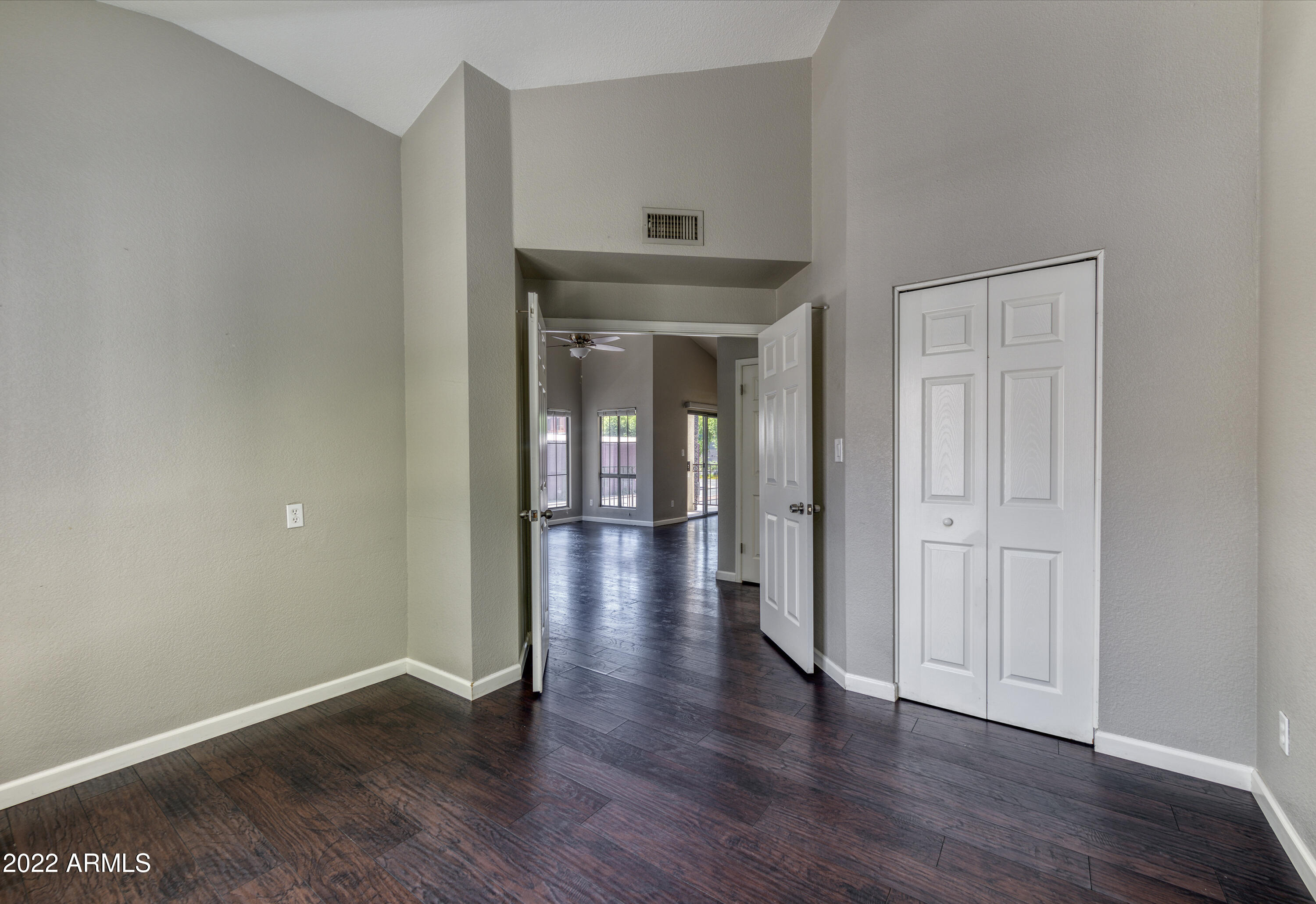 100 East Fillmore Street, Unit 201 Phoenix, AZ 85004 - Photo 19 of 23 wooden floor in an empty room with a window