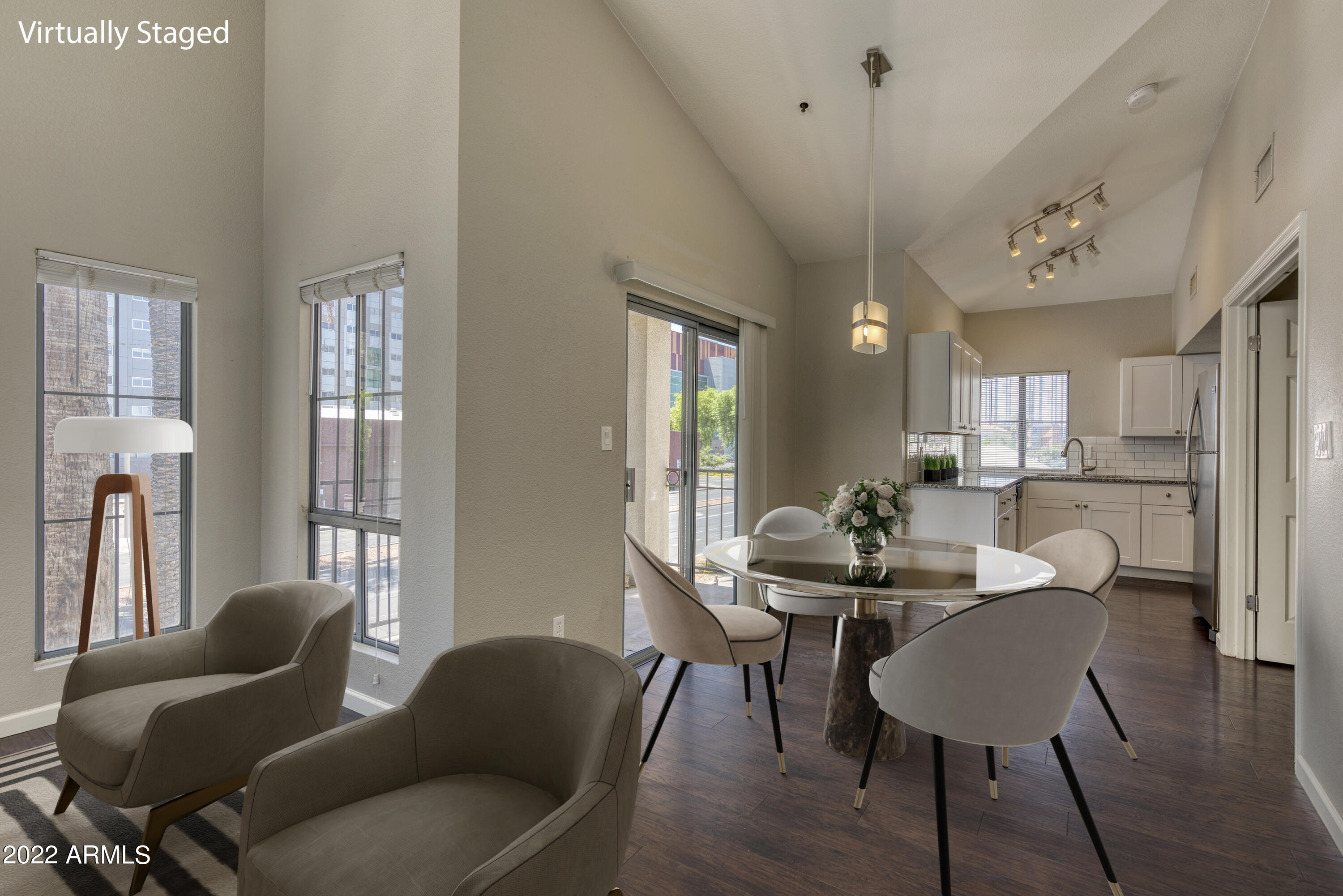 100 East Fillmore Street, Unit 201 Phoenix, AZ 85004 - Photo 2 of 23 a view of a dining room with furniture and wooden floor
