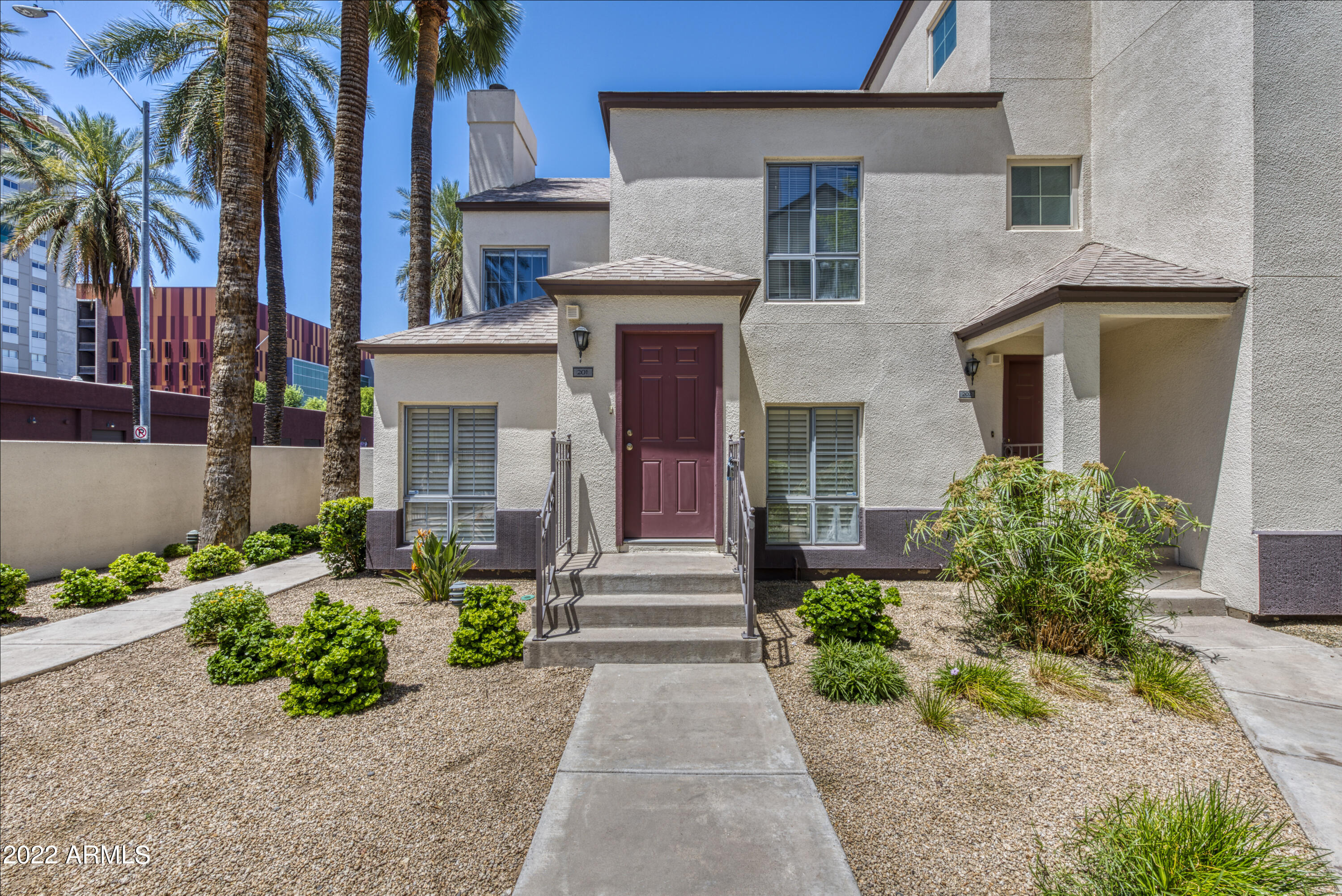 100 East Fillmore Street, Unit 201 Phoenix, AZ 85004 - Photo 6 of 23 front view of a house with a yard