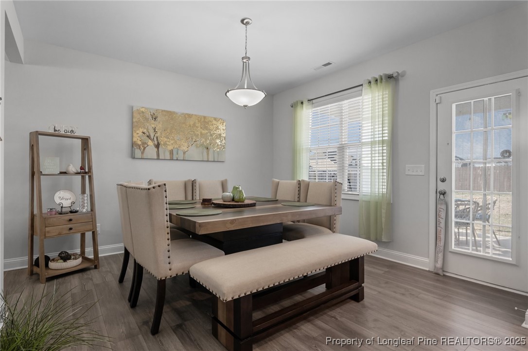1660 Stackhouse Drive Fayetteville, NC 28314 - Photo 17 of 44 a living room with furniture a table and a large window
