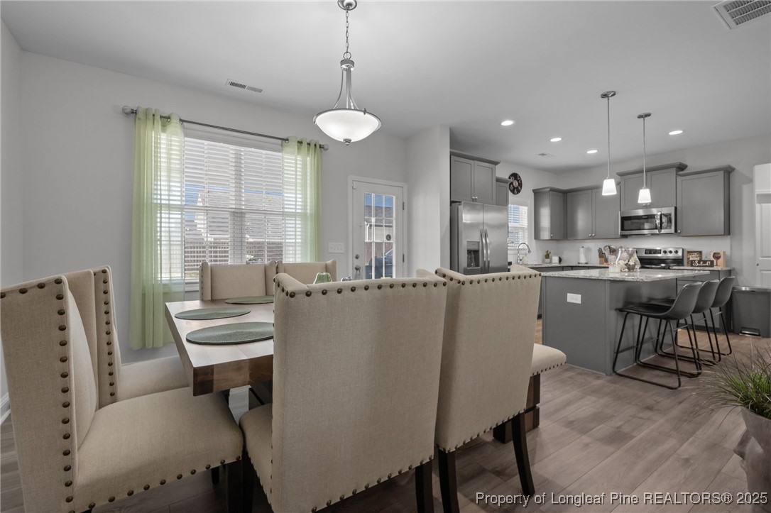 1660 Stackhouse Drive Fayetteville, NC 28314 - Photo 18 of 44 a living room with stainless steel appliances kitchen island granite countertop furniture and a kitchen view