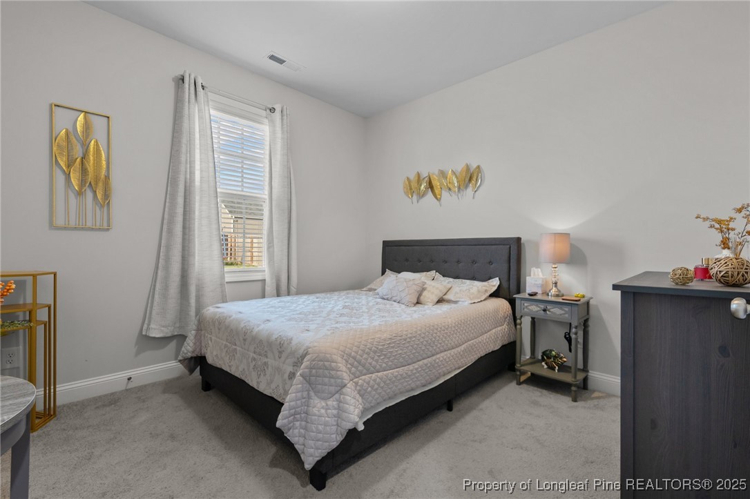 1660 Stackhouse Drive Fayetteville, NC 28314 - Photo 20 of 44 a bedroom with a bed and a window