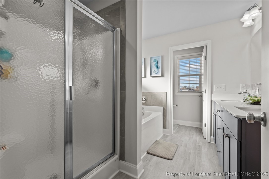 1660 Stackhouse Drive Fayetteville, NC 28314 - Photo 30 of 44 a spacious bathroom with a shower sink and mirror
