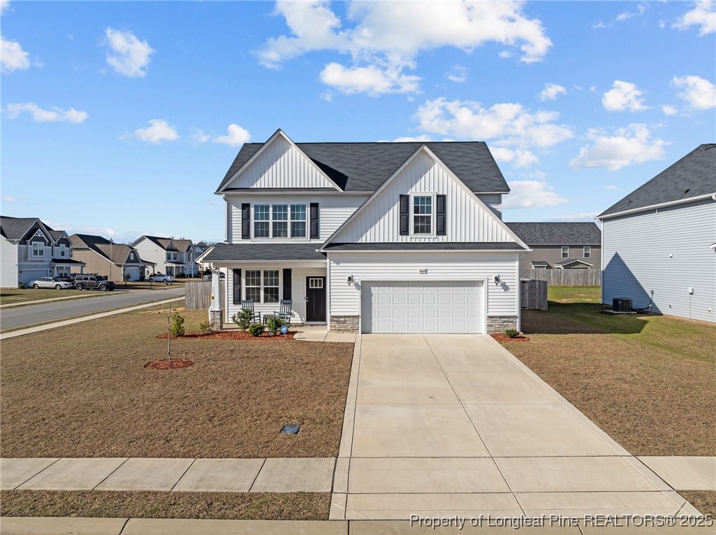 1660 Stackhouse Drive Fayetteville, NC 28314 - Photo 3 of 44 a front view of a house with a yard