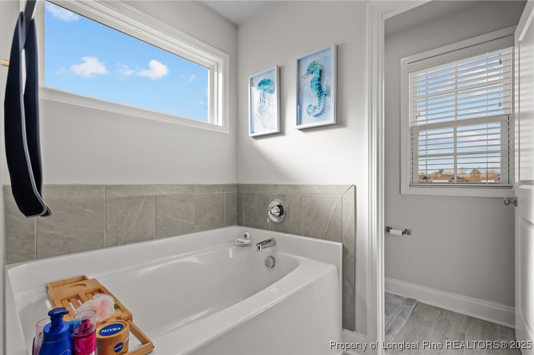 1660 Stackhouse Drive Fayetteville, NC 28314 - Photo 32 of 44 a bathroom with a tub and a window