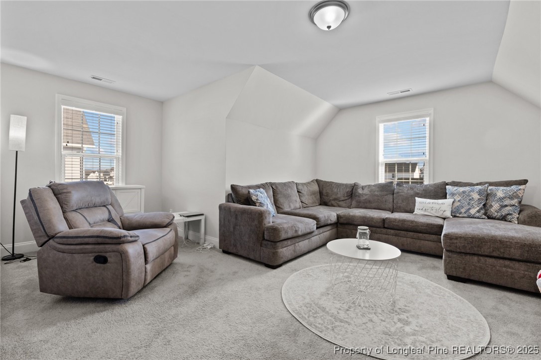 1660 Stackhouse Drive Fayetteville, NC 28314 - Photo 33 of 44 a living room with furniture and a window